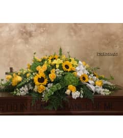 Sunshines Casket Spray. An arrangement by Geni's Florist and Gifts.