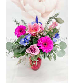 LOVESBLOOMS. An arrangement by Grande Prairie Florist.