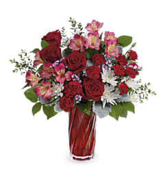 Loves Swirling Devotion. An arrangement by L and J Blooms. Loves Swirling Devotion. An arrangement by L and J Blooms.