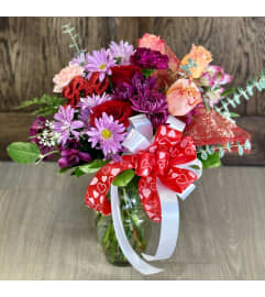 Vibrant Bundle of love. An arrangement by Sussex County Florist.