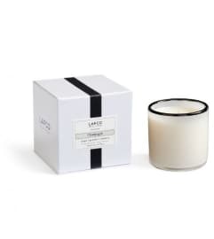PENTHOUSE CANDLE: Champagne 6.5oz. An arrangement by Metcalfe Florist and Pleasant View Greenhouses.