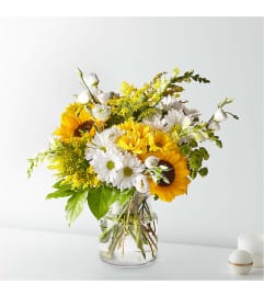 Sunshine in Bloom. An arrangement by Mae's Flowers and Gifts.