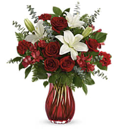 Love Conquers All. An arrangement by Palmetto Gardens Florist.