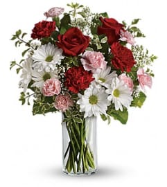 A Kiss In The Park. An arrangement by Palmetto Gardens Florist.
