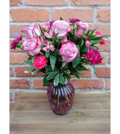 By Design Berry Bliss. An arrangement by Flowers By Design.