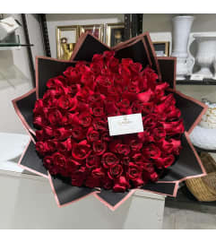 100 Red Roses Buchon. An arrangement by Paty's Florist.