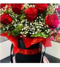 Red Roses in a Box. An arrangement by Geni's Florist and Gifts.