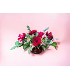 Blooms of Devotion. An arrangement by Vanessa's Flower Shop.