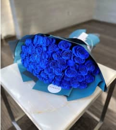 50 BLUE ROSES WRAP BOUQUET. An arrangement by BellaRosa Gardens. 50 BLUE ROSES WRAP BOUQUET. An arrangement by BellaRosa Gardens.