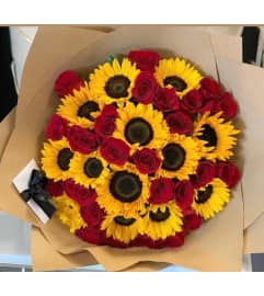 RED ROSES AND SUNFLOWER BOUQUET. An arrangement by BellaRosa Gardens.