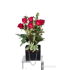 Purse box with roses. An arrangement by The Flower Garden.