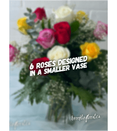 Mixed Colour Dozen Roses In A Vase. An arrangement by Brooklin Floral and Garden Shoppe Inc..