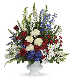 With Distinction Pedestal. An arrangement by Love Story Florist.