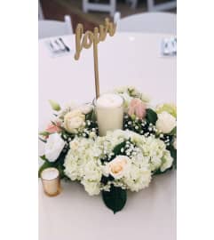 Short Center Pieces Bqt. An arrangement by Geni's Florist and Gifts.