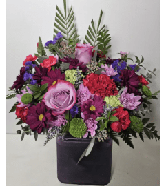 TRIPLE A'S PALM SPRING ARRANGEMENT. An arrangement by Triple A Florist. TRIPLE A'S PALM SPRING ARRANGEMENT. An arrangement by Triple A Florist.