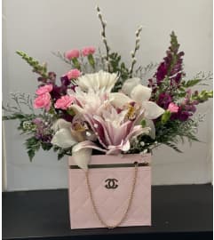 Chanel Flower Hand Bag. An arrangement by K1 Floral Studio.