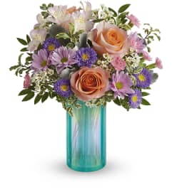 Aqua Rose (Teleflora). An arrangement by North Liberty Flower Shop.