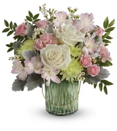 Lush Garden (Teleflora). An arrangement by North Liberty Flower Shop.