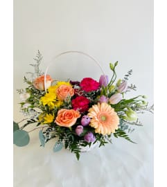 Easter Egg Hunt Basket. An arrangement by Avenida Flowers.