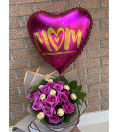 Tata’s Bouquet and balloon. An arrangement by Lake Eola Florist.