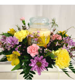 Medium Cheerful Giver Centerpiece. An arrangement by Busse and Rieck Flowers Plants and Gifts.