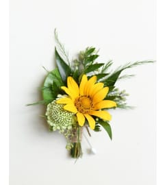 Yellow Boutonniere. An arrangement by Twigs Flower Company.