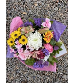 HAND TIED AND WRAPPED BOUQUET. An arrangement by Country Girl Flowers.