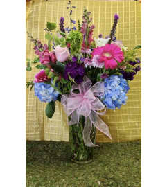 Blossom by Blossom. An arrangement by Clark's House of Flowers.
