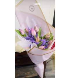 Tulips Delicacy. An arrangement by Geni's Florist and Gifts. Tulips Delicacy. An arrangement by Geni's Florist and Gifts.