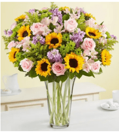 Unique Sunflowers and Rose. An arrangement by Brickell Ave Florist.