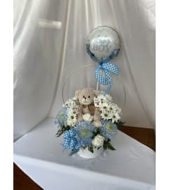 Baby boy celebration arrangement. An arrangement by Flowers By Gerry.