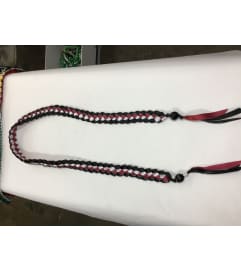 ribbon lei #A. An arrangement by Royal Louis Florist.