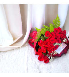 2 Dozen Red Roses Wrapped. An arrangement by Flower World and Gifts.
