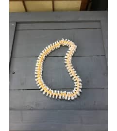ribbon lei #32. An arrangement by Royal Louis Florist.
