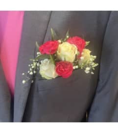 Pocket Boutonniere with a Pop of Pink. An arrangement by Loyalist Flowers.