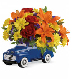 Teleflora's Vintage Ford Pickup Bouquet. An arrangement by Sueppel's Flowers.