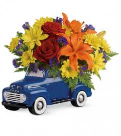 Vintage Ford Pickup Bouquet. An arrangement by North Liberty Flower Shop.