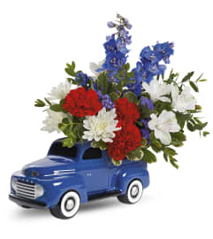 Heyday Ford Pick (Teleflora). An arrangement by North Liberty Flower Shop.