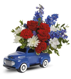 Heyday Ford Pick (Teleflora). An arrangement by North Liberty Flower Shop.
