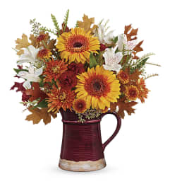 Teleflora's Blooming Fall Pitcher. An arrangement by Love Floral.