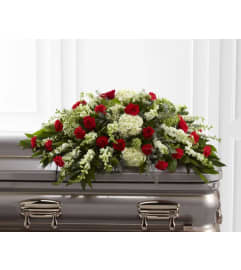 Sincerity Casket Spray. An arrangement by Michael's Flowers.