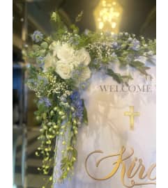 Entery Welcome Sign floral accent. An arrangement by Floral Lady Design Studio LLC.