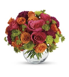 A testy mix of Hot Pink and Orange. An arrangement by Flowers and Beyond.