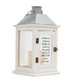 Sympathy Lanterns. An arrangement by Bourbon Babes Bouquet and Boutique.