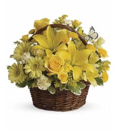 Basket of Sun Color. An arrangement by Flowers and Beyond.