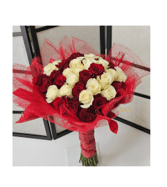Wrap In Love Hand-Tied Bouquet. An arrangement by Brickell Exclusive Blooms.