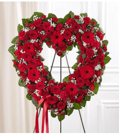 Garden Always Remember Floral Heart Tribute- Red. An arrangement by Garden Florist.