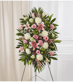 Garden Pastel Sympathy Standing Spray. An arrangement by Garden Florist.
