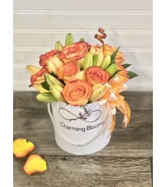 Petite Box Arrangement. An arrangement by Charming Blooms.