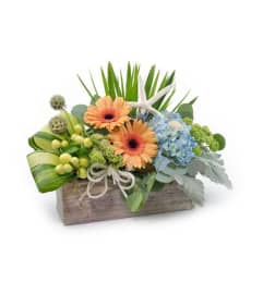 WOOD BOX. An arrangement by Flowers and Beyond.